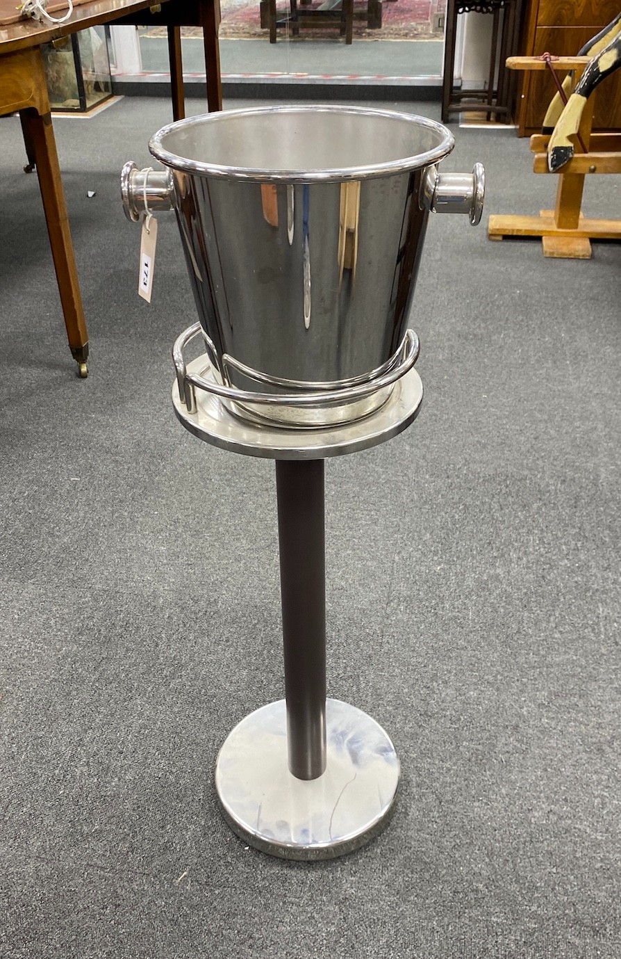 An Alessi wine cooler and stand height 82cm.
